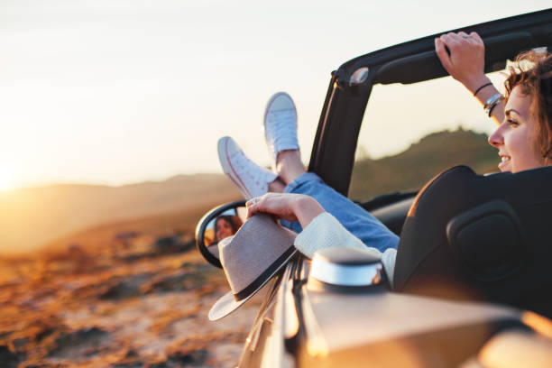 istock Girl watching at sunset from a car 842604828