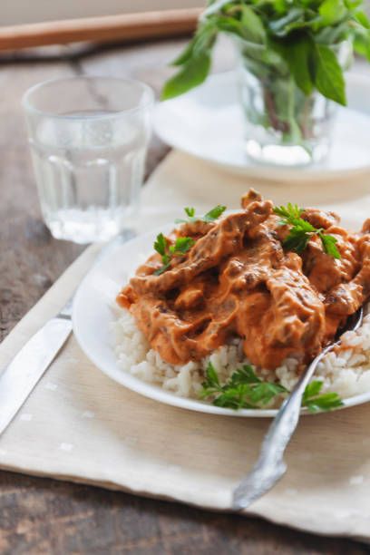 istock Dish rice with beef stroganoff on a white plate 842606146