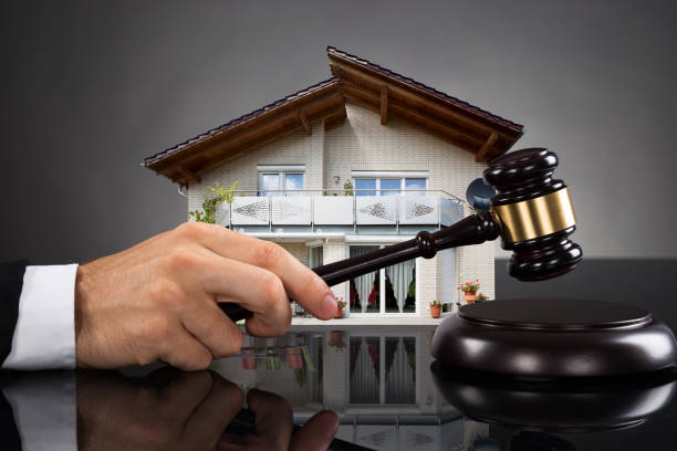 istock Judge With House Model Hitting Gavel 842609122
