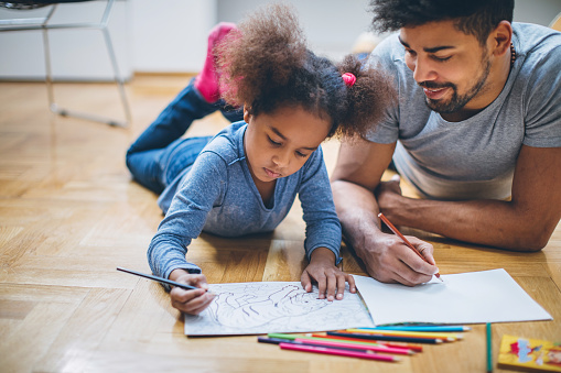 Young black family having fun at home