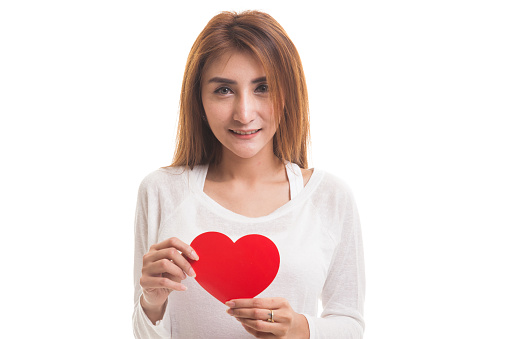 Asian woman with red heart  isolated on white background