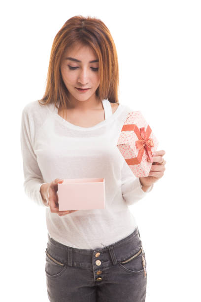 istock Young Asian woman open a gift box. 842621286