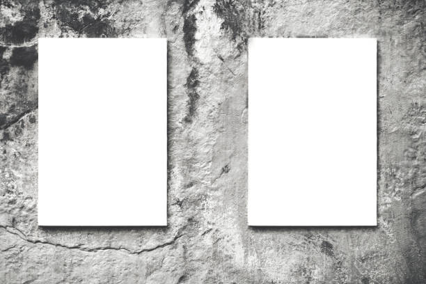 istock Two vertical hanged white billboard or empty blank canvas on city concrete wall background 842624100