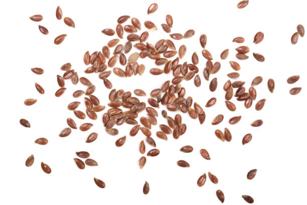 istock flax seeds isolated on white background. Top view 842626462