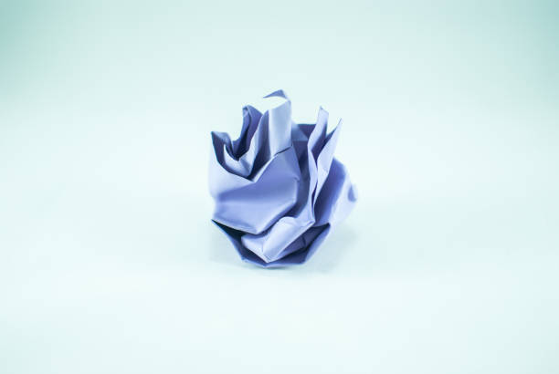 istock Crumpled blue paper ball on the white background, isolated 842628800