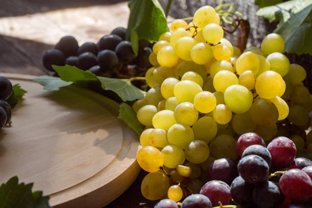 istock bunch of white grapes on the table 842629050