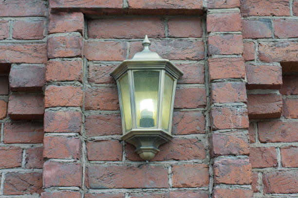 istock Lantern on brick wall of old city. 842629074