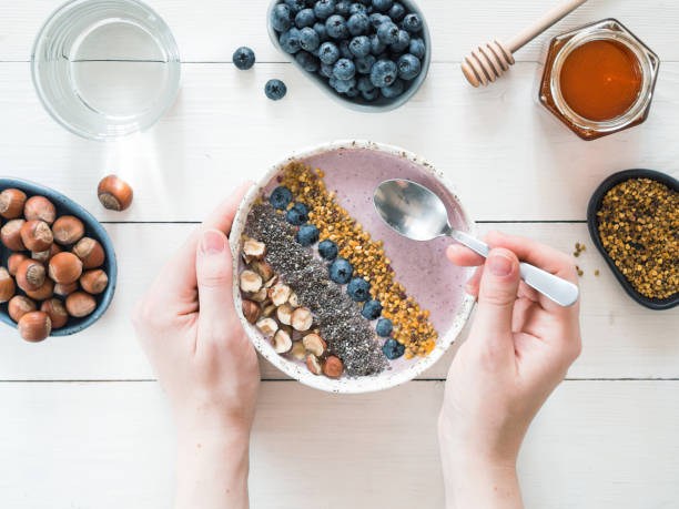 istock Breakfast bowl in woman hands 842632292