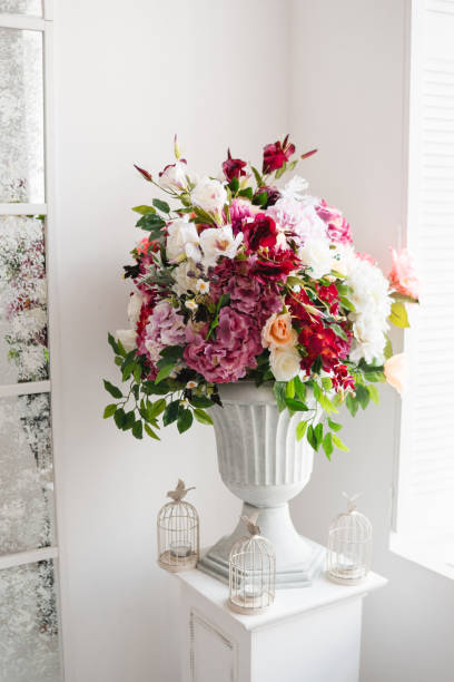 istock Beautiful flowers in classic white vase 842632888