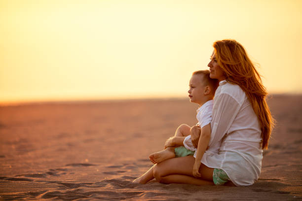 istock Mother and son on the beach 842635608