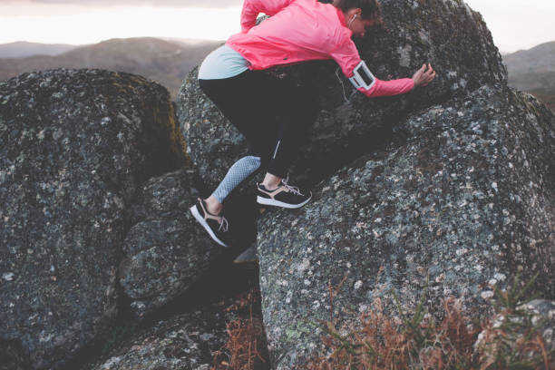 istock Woman doing workout in the mountains at sunset 842635648