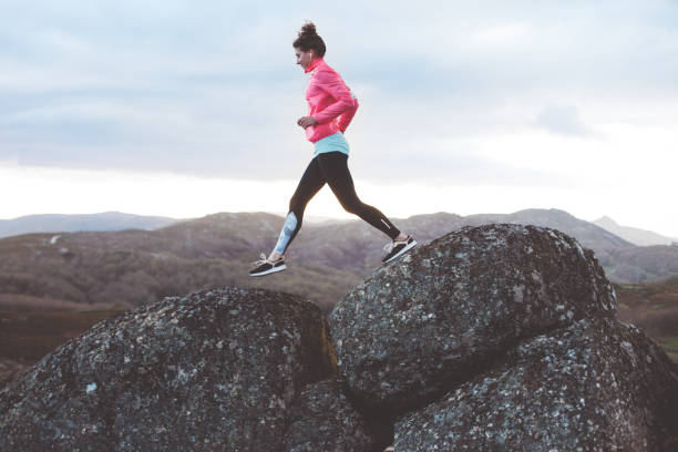 istock Woman doing workout in the mountains at sunset 842635674