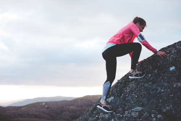 istock Woman doing workout in the mountains at sunset 842635710