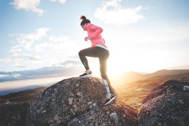 istock Woman doing workout in the mountains at sunset 842635842