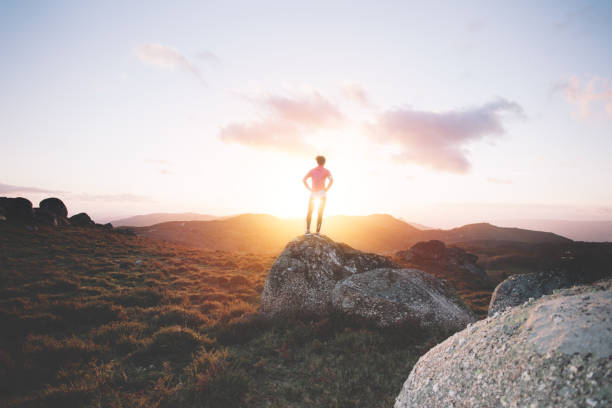 istock Woman doing workout in the mountains at sunset 842638534