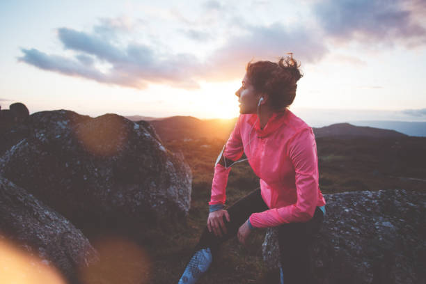 istock Woman doing workout in the mountains at sunset 842638536