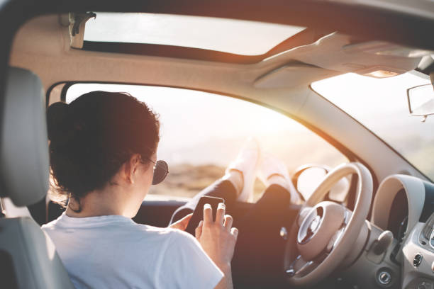 istock Happy woman resting in the car and using phone 842638580