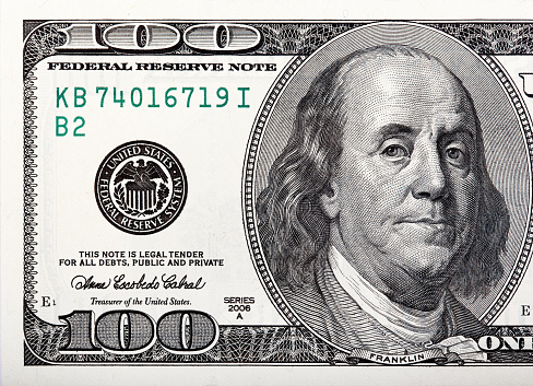 Benjamin Franklin on the bill. Macro shot of a 100 dollar. High resolution photo.