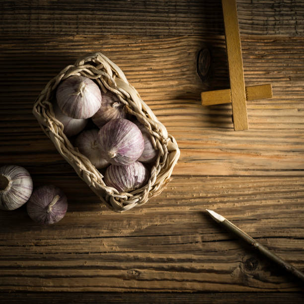 istock fresh garlic, aspen stake and holly cross 842643992