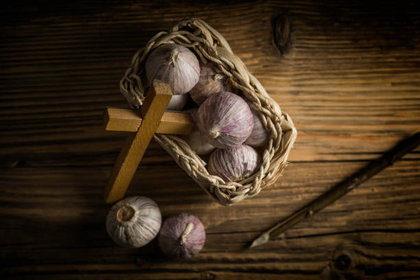 fresh garlic, aspen stake and holly cross
