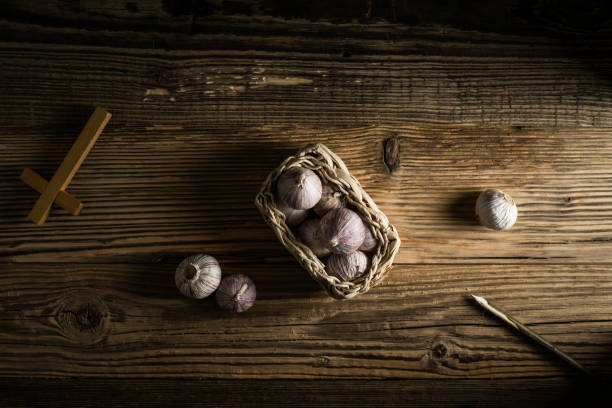 istock fresh garlic, aspen stake and holly cross 842644016