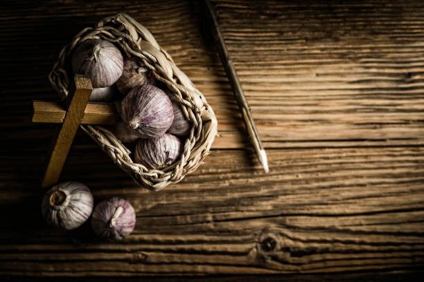 istock fresh garlic, aspen stake and holly cross 842644026