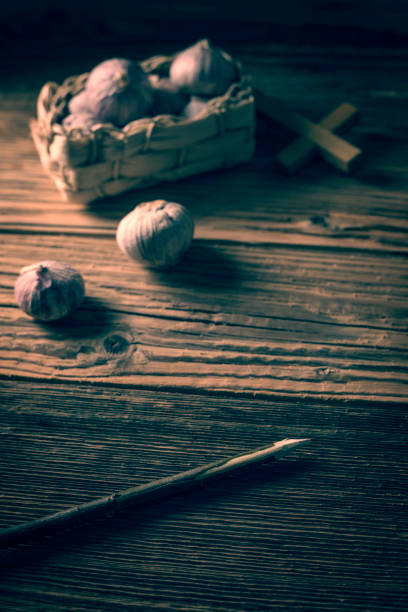 istock fresh garlic, aspen stake and holly cross 842644030