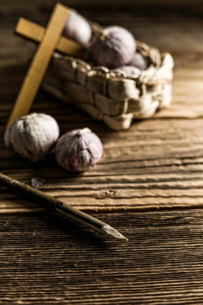 istock fresh garlic, aspen stake and holly cross 842644034