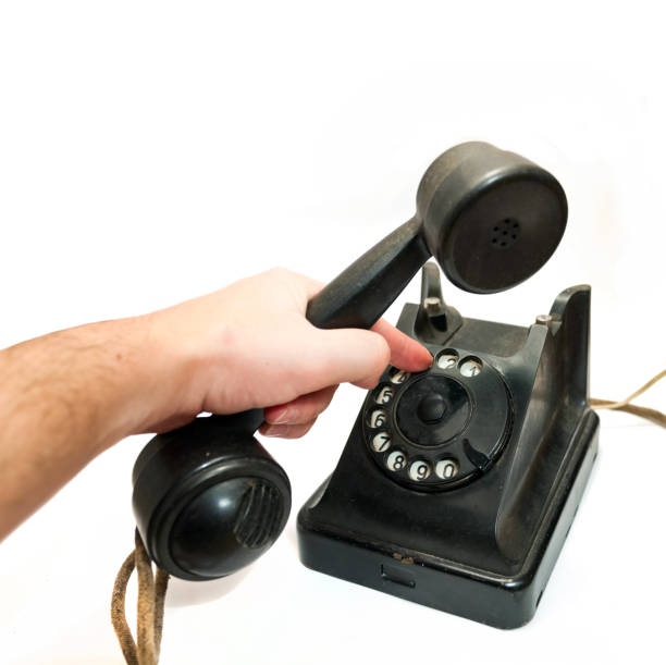 Vintage telephone being picked up