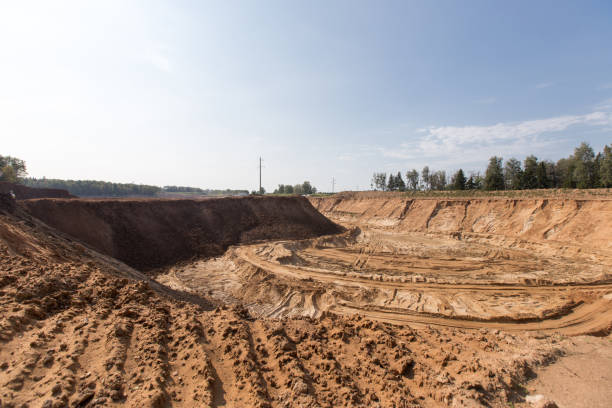 istock Minning in a sand quarry with powerful machines 842650470