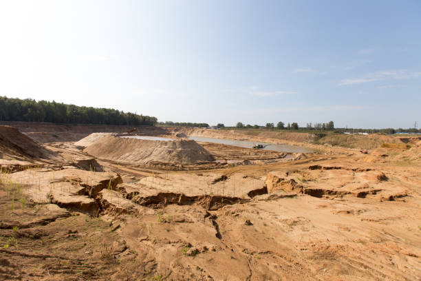 istock Minning in a sand quarry with powerful machines 842652626