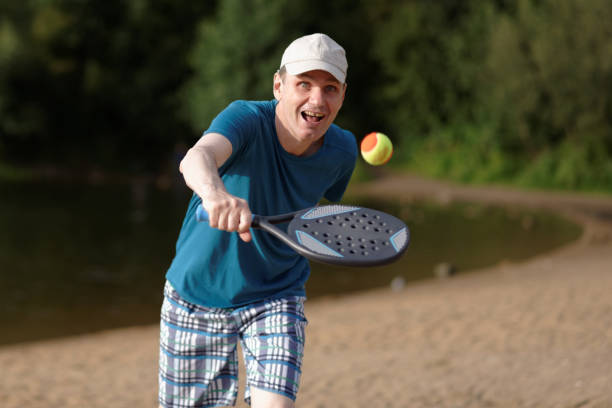istock Man playing beach tennis 842656120