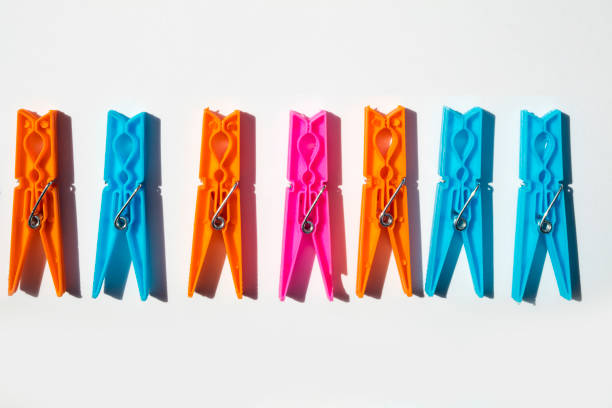 Group of clothes pegs on in white isolated background.