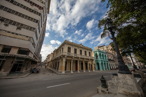 Havana, Cuba - January 28, 2017: Typical scene of one of streets in the center of La Havana - colonial architecture. Incidental people on the street.