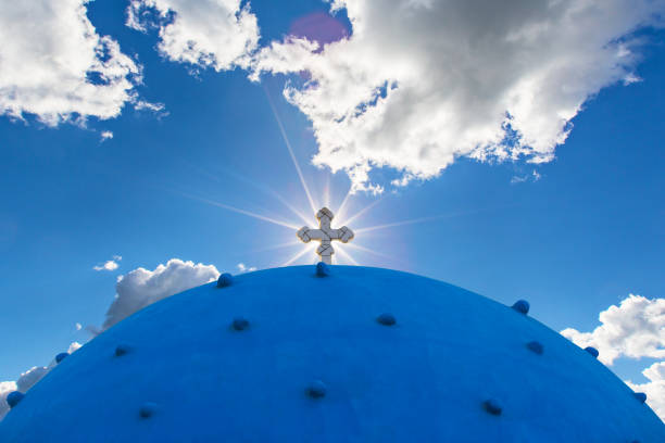 Classic view of blue dome church in Santorini. Oia Village, Greece.
