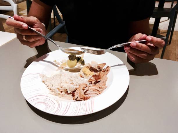 istock Girl Eating Rice with Five Spice Stew and Pork 842673982