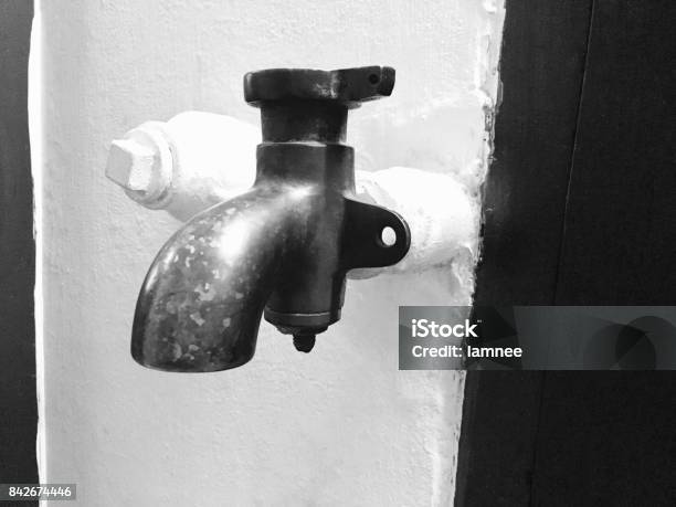 Black Metal Faucet Installed On The Wall Stock Photo - Download Image Now - Bathroom, Clean, Concepts