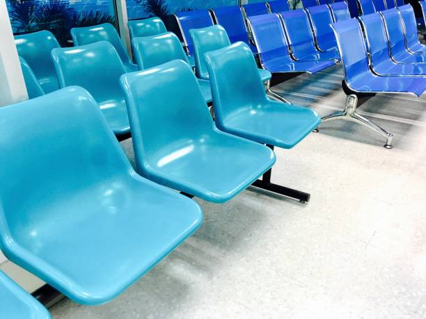 istock Row of Empty Chairs in Waiting Room 842674474