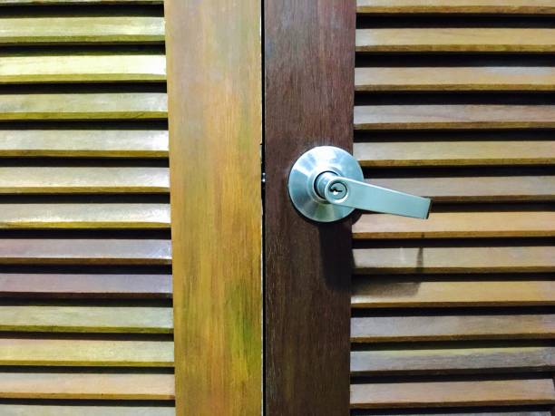 istock Lock and Door Handle on Brown Wooden Door 842674536