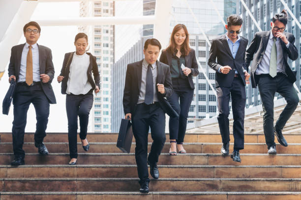 istock Group of Business People Running in Row 842678498