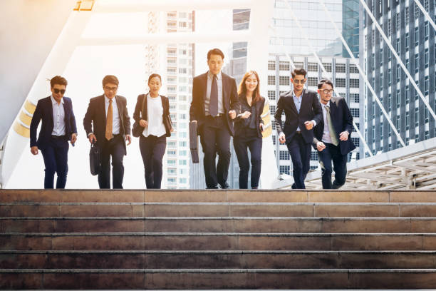 istock Group of Business People Running in Row 842678518