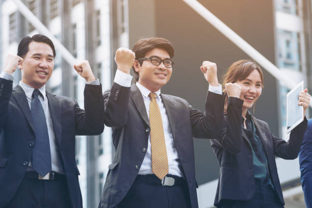istock Successful business people with arms up 842678562