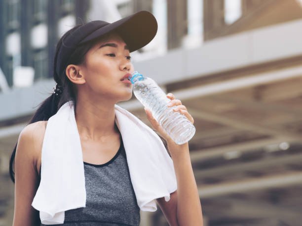 istock Sport woman with drinking water bottle 842678616