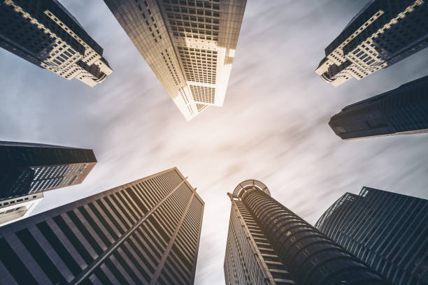 istock Business buildings skyline looking up with blue sky 842679116