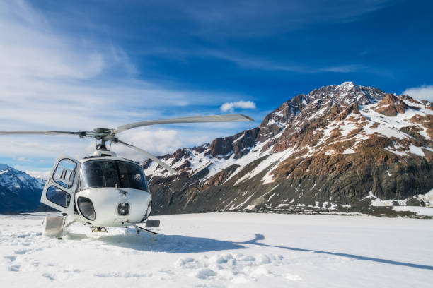 istock Helicopter Landing on a Snow Mountain 842679340