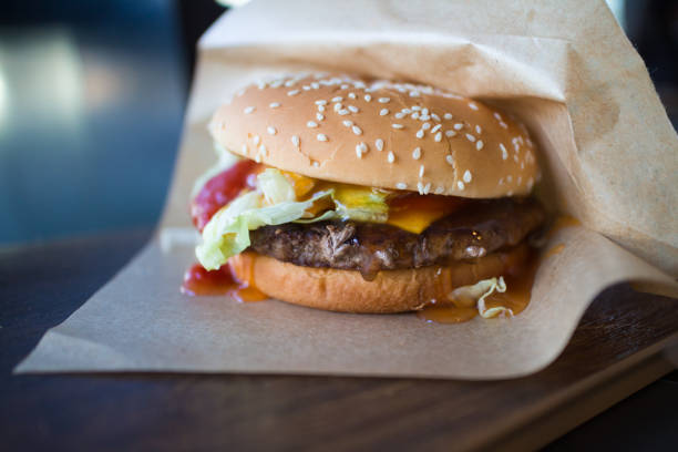 istock juicy hamburger with beef and ketchup on the table 842679678