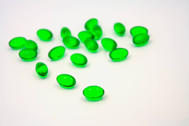 istock green pills soft gel capsule isolated on white background 842689226