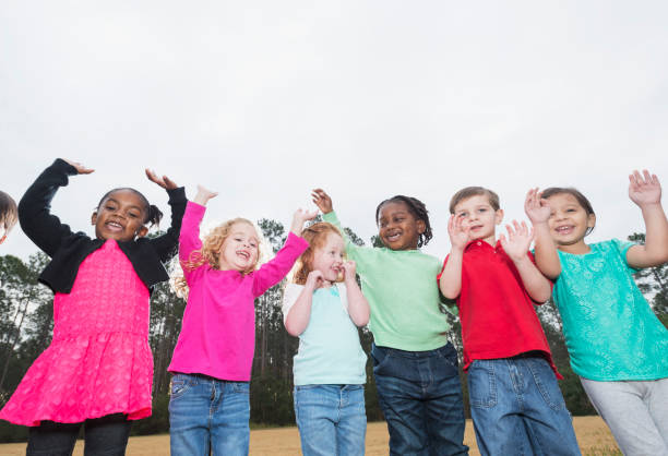 istock Multi-ethnic group of young children standing in a row 842689390