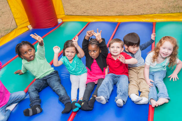 istock Multi-ethnic group of children in bounce house 842689394