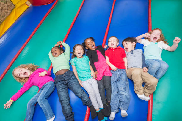 istock Multi-ethnic group of children in bounce house 842689420